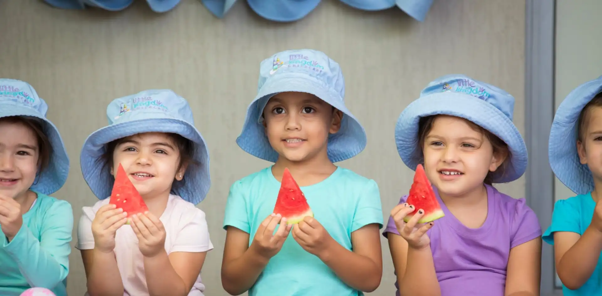 Children holding watermelon slices - Little Kingdom Childcare in Mount Tarcoola, Geraldton