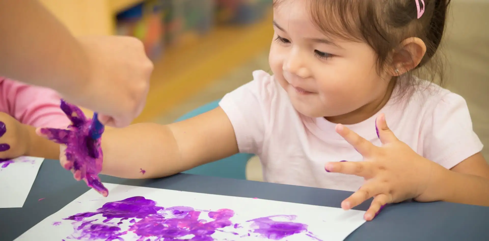 Child finger painting - Little Kingdom Childcare in Mount Tarcoola, Geraldton